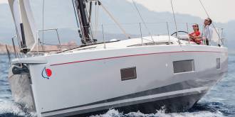 Man and woman sailing Sunsail 524
