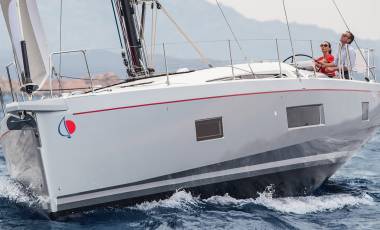 Man and woman sailing Sunsail 524